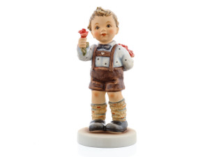 M.I. Hummel figurine HUM 2422 Gentleman of Roses featuring a boy holding a bouquet and a single hand-sculpted red rose, handcrafted in Germany.