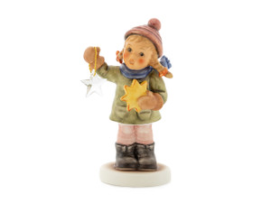 Holiday Fun HUM 2204 Swarovski Edition M.I. HUMMEL figurine of a girl with a Christmas ornament