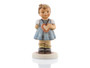 M.I. Hummel My Heart’s Desire figurine HUM 2102/A featuring a young Bavarian girl in a traditional blue Dirndl dress with a heart.