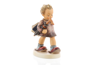 M.I. Hummel 'The Professor' (HUM 320/0) features a young boy with an orange bow tie and oversized slippers, holding a blue notebook behind his back.