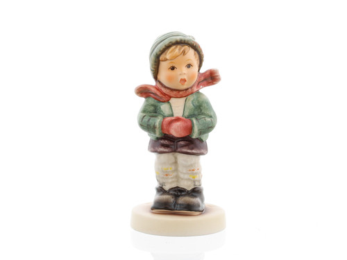 It's Cold HUM 421 4/0 M.I. HUMMEL figurine of a shivering boy in winter clothes. Close-up of the detailed mittens and jacket on the M.I. HUMMEL It's Cold figurine.