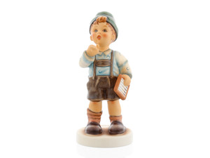 M.I. Hummel figurine HUM 2429 Multiplication Tables featuring a young school boy calculating math problems, handcrafted in Germany.