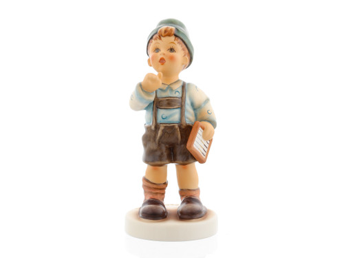 M.I. Hummel figurine HUM 2429 Multiplication Tables featuring a young school boy calculating math problems, handcrafted in Germany.