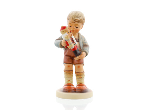 Nutcracker Sweet HUM 2130 M.I. HUMMEL figurine with traditional German nutcracker.