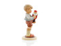 Close-up of the brightly painted nutcracker and classic Hummel child details on HUM 2130.
