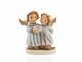 Heaven and Nature Sing HUM 2096/Q M.I. HUMMEL figurine of two angels singing with sheet music.