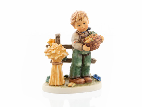 Harvest Thanksgiving HUM 2439 M.I. Hummel figurine of a boy with a pumpkin and a grain sheaf.