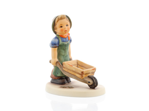 M.I. Hummel 'Little Landscaper' (HUM 2011) showing a young boy in work clothes pushing a traditional wooden wheelbarrow.