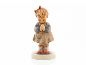 Evening Prayer HUM 495 M.I. Hummel figurine of a young girl with folded hands in prayer.