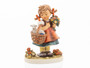 M.I. Hummel figurine HUM 928 Happy Easter featuring a young girl in a traditional dress carrying a basket with a small lamb, handcrafted in Germany.