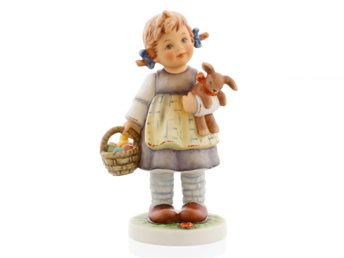 M.I. Hummel figurine HUM 2432 Busy Rabbit featuring a girl holding a bunny and a basket of colorful Easter eggs with a small chick.