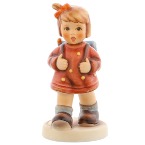 Classic M.I. Hummel figurine HUM 467 "The Kindergartner" featuring a girl with a blue school bag.