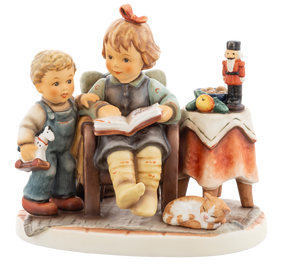 M.I. Hummel figurine HUM 2392 Christmas is Coming featuring siblings reading in an armchair with a Nutcracker and a sleeping cat, handcrafted in Germany.