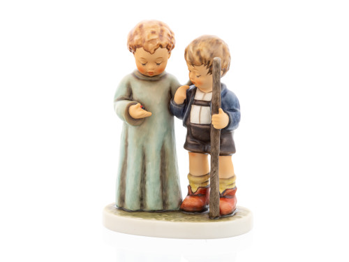 M.I. Hummel figurine HUM 930 Wondering featuring a guardian angel showing a lucky ladybug to a young boy in Lederhosen, handcrafted in Germany.