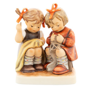 Starting Young Hum 469 M.I. Hummel Club 45th Anniversary figurine featuring two young girls sewing and knitting.