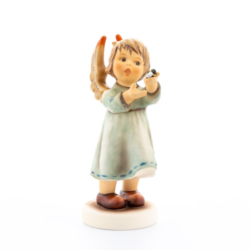 M.I. Hummel Annual Angel 2021 figurine HUM 2443, a girl angel with a tiny bumblebee on her hand, hand-painted porcelain.