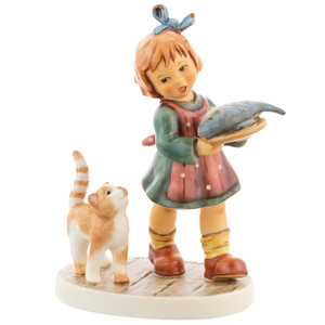 M.I. Hummel figurine HUM 2445 Get Him! featuring a young girl in a polka-dot apron carrying a fish while a small cat looks on hungrily.