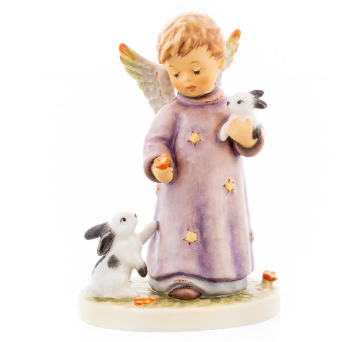 M.I. Hummel 'Peacefully United' figurine HUM 2403 showing an angel in a purple star-patterned robe holding two small bunnies. Close-up of the red and yellow hand-painted star accents on the angel’s robe and wings of the Peacefully United figurine.