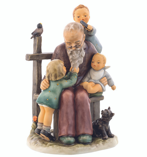 M.I. Hummel Limited Edition figurine HUM 621 At Grandpa’s, featuring a grandfather sitting with three grandchildren playing on his lap, handcrafted in Germany.