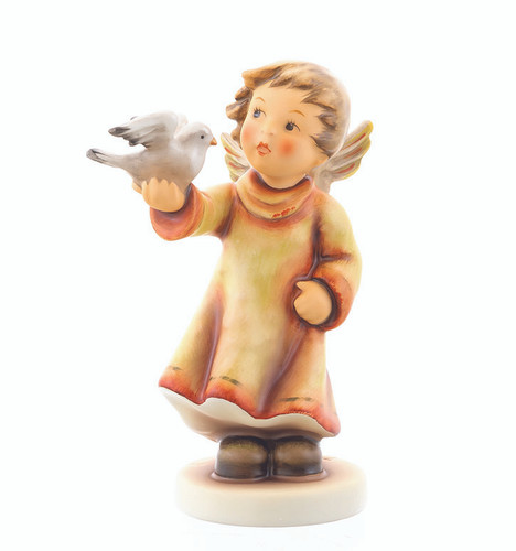 M.I. Hummel figurine Fly Out HUM 2315 showing a young angel in a red and yellow robe holding a white dove of peace.