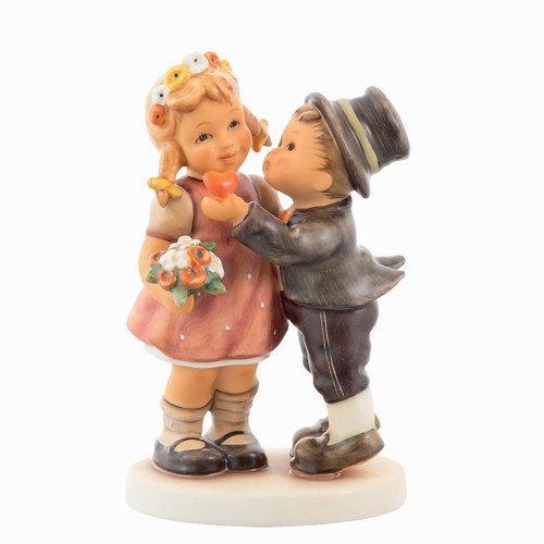 M.I. Hummel Bride and Groom figurine HUM 2453 featuring a couple in traditional Bavarian wedding attire with a floral wreath and lederhosen