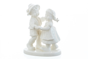M.I. Hummel 'First Dance' White Edition figurine HUM 2364 featuring a bride and groom in monochromatic white porcelain.
