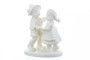 M.I. Hummel 'First Dance' White Edition figurine HUM 2364 featuring a bride and groom in monochromatic white porcelain.