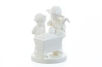 M.I. Hummel 'Blessed Event' White Edition figurine HUM 333 featuring an all-white porcelain boy and girl looking at a baby in a cradle