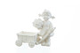 White Edition M.I. Hummel figurine HUM 2013 of a girl with a pull-along flower trolley.