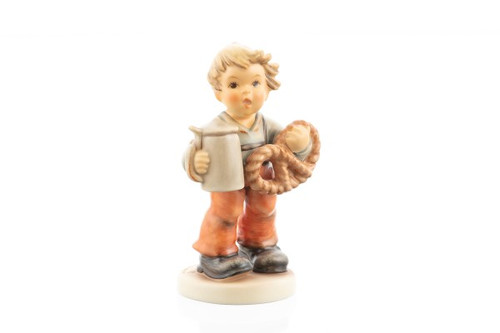 M.I. Hummel Pretzel Boy HUM 2003 porcelain figurine of a young boy holding a pretzel and a beer stein.