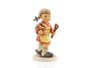 M.I. Hummel Mixing the Cake HUM 2167 porcelain figurine of a girl with braids, red dress, and wooden spoon.