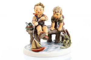Exclusive 50th Anniversary M.I. Hummel Club figurine 'Little Captains' HUM 2083 featuring two boys launching a sailboat.