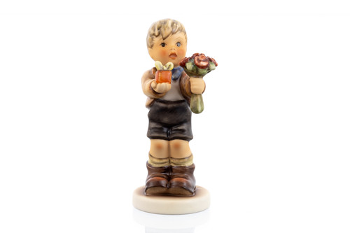 M.I. Hummel Johannes HUM 2459 companion figurine for Club Year 50 holding flowers and a gift.