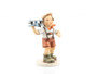 Authentic M.I. Hummel figurine HUM 2173 showing a young boy running with a toy airplane ready to fly.