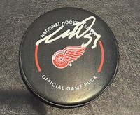 Moritz Seider 2022-23 Autographed Detroit Red Wings Game Puck 