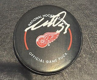 Moritz Seider 2022-23 Autographed Detroit Red Wings Game Puck