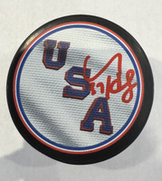 Connor Hellebuyck Autographed Team USA Logo Puck