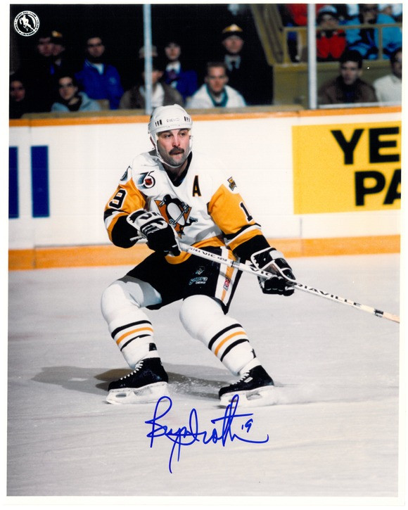 Bryan Trottier of the Pittsburgh Penguins passes the puck during