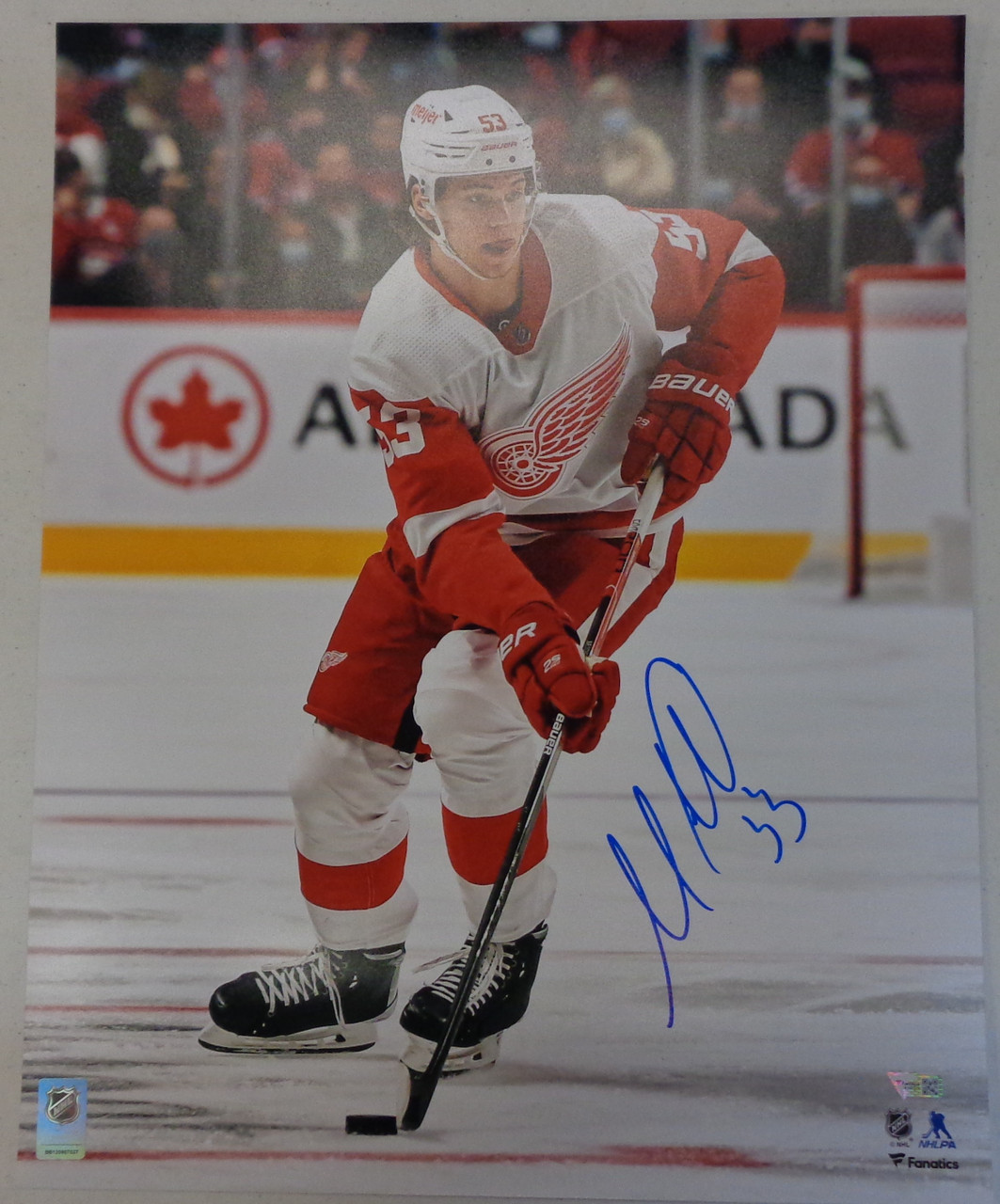 Moritz Seider Detroit Red Wings Autographed 16 x 20 Skating with Puck Photograph