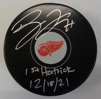 Dylan Larkin Autographed Detroit Red Wings Souvenir Puck w/ "1st Hatrick 12/18/21"