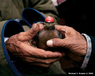 Zoolan, Khövsgöl Province, Mongolia

In a ritual greeting between two Mongolian elders, the bearer of this snuff bottle offers it with his right hand, while the left is cupped under his elbow. Passing objects in this way is a sign of respect, holiness, and purity.

Photo © 2000 Michael J. Kresko; featured in the 2001 International Calendar