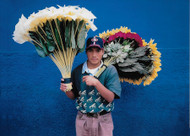 Mexico Flower seller.

Contemporary street vendors in Mexico—especially the boys—often sport Western clothing and baseball caps. These flower sellers, with their oversized floral bundles, can sometimes be seen near brightly painted stucco walls, making for vibrant photographic portraits.

Photo © 1999 Zane Williams; The International Calendar Project