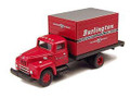 Red short box truck with white lettering