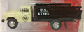 1960 era Ford stake truck with white cab and black stake bed.  US Steel logo on door and also on stake bed.