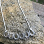 Horseshoe bar necklace. This is my take on the fashion statement necklace, except with horseshoes. Six small horseshoes in a row with a chain. As always, available in sterling and gold. You can customize with any gemstone.