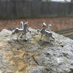 Prancing horse cuff links. This accessory is a must in the business or horse show world. An Artsy version of a saddle horse made into cufflinks. Available in gold or sterling silver.
