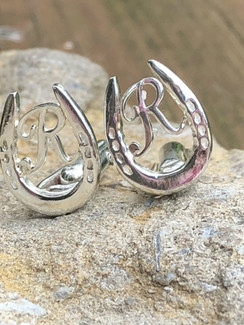 Show shoe cufflinks with your initial. Cufflinks are an accessory that are essential in the horse show world and in the business world. They accentuate any suit, whether business or riding. Available in sterling silver or gold and please specify which initial letter you wish