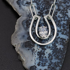 Sterling silver open concept horseshoe with CZ.