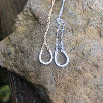 14k gold horseshoes with a 16-inch chain. Comes in rose gold also. Diamonds on this delicate horseshoe is .08 tcw. A perfect piece to layer your equestrian necklace with. Call 8593330458 with questions