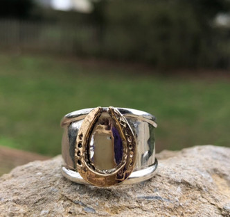 fun Hammered horseshoe ring in 14K gold and sterling silver. Price is based on a size 7 and will cost more to size. It is a very beautiful addition to your equestrian jewelry box and is very bold.
